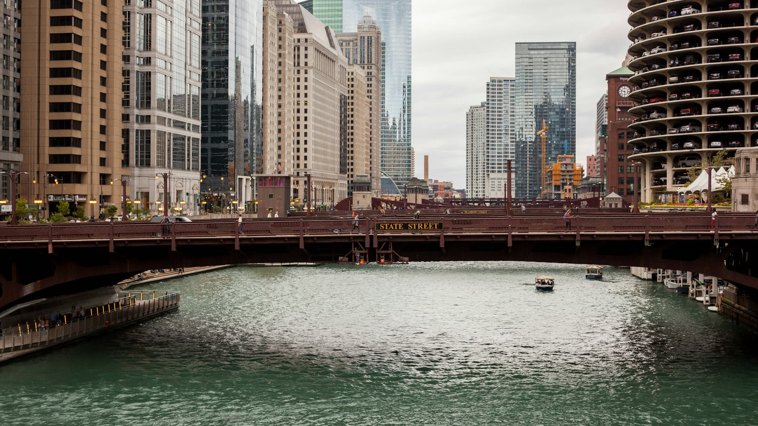 Chicago River with Marina City and downtown skyline under overcast sky